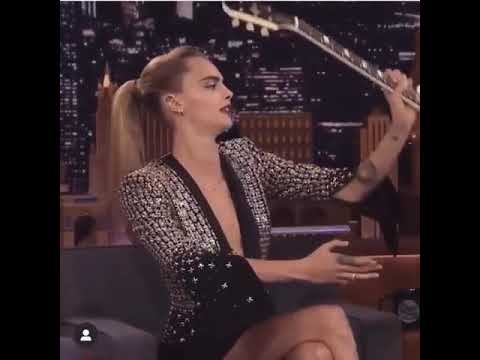 Cara Delevingne 2019 playing guitar behind her back Jimmy Fallon New