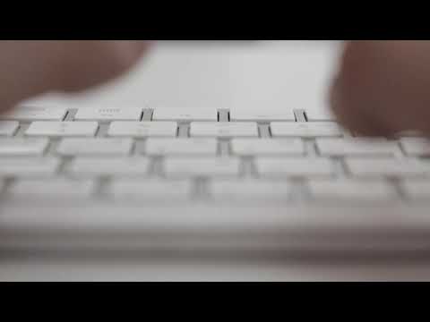 Typescript. Fingers are typing on the keyboard ( Video Background Stock Footage Free )
