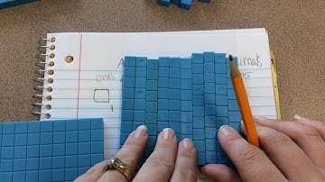 Adding decimals using place value blocks
