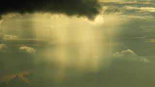 Close-up of Sunrays shining through cloud
