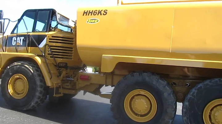 Caterpillar 730 articulated truck with New 6,000 gallon HEC water tank