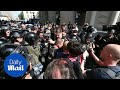 Protesters clash with riot police in Moscow, Russia