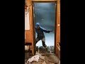 Daily Routine in Antarctica: Brave Adventurer Confronts Strong Winds, Fights to Shut Door