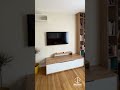 Aménagement complet d’un espace salon avec meuble TV et rangements sur mesure.