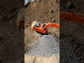 Excavator Power: Watch Heavy Machinery Dump Gravel! 🏗️