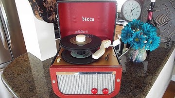 Decca record player playing a stack of 45 RPM 7" records