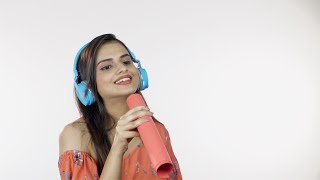 Young girl listening to her favorite song - Using blue headpho... | Indian Stock Footage | Knot9