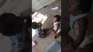 My twins fight over bottle