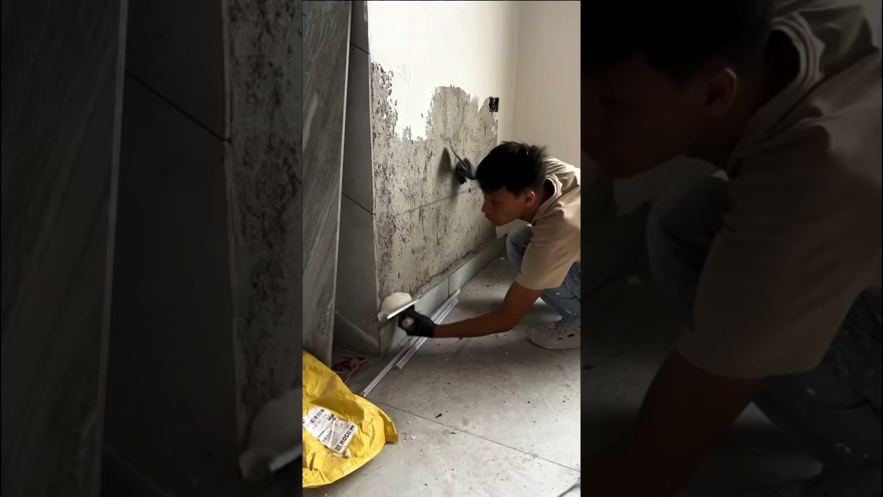 Interior wall putty plastering process Construction skills of a worker
