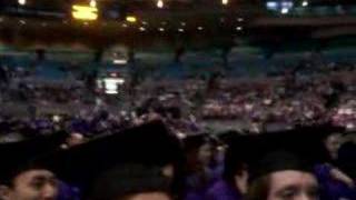 NYU graduates doing the wave at CAS graduation