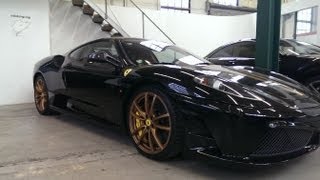 In this video you can see two ferrari 430 scuderia! both are fitted
with golden rims but one is black stripes and the other red black...