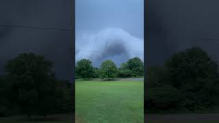 Storm Clouds Meet Golden Sunset Over Green Field