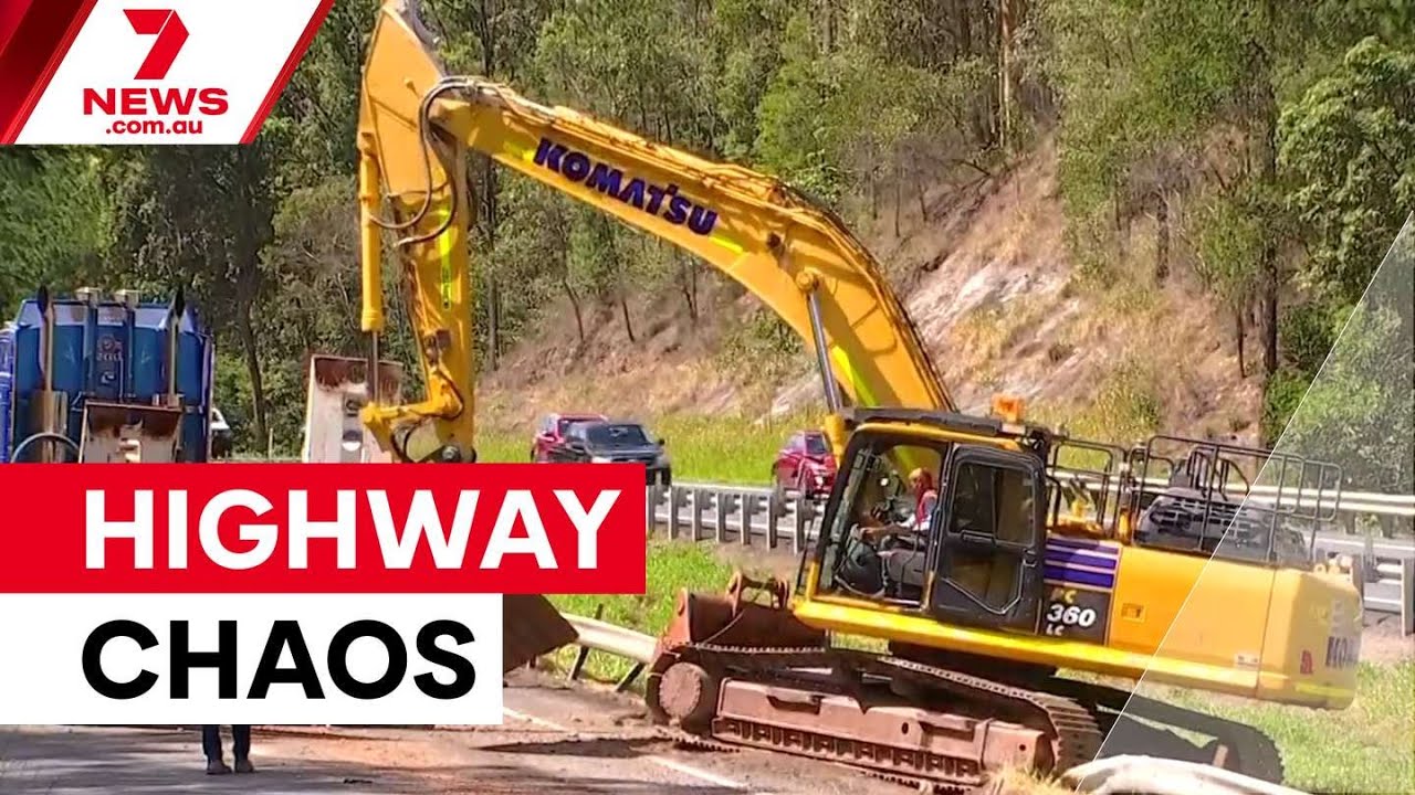 Truck smashes into Bruce Highway overpass | 7NEWS - YouTube