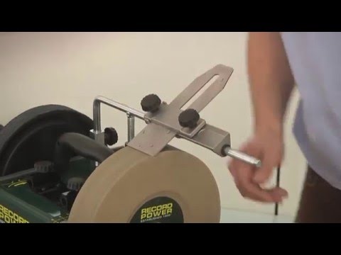 Sharpening A Knife Blade On A Wet Sandstone Grinding Wheel Stock Photo,  Picture and Royalty Free Image. Image 34654032.