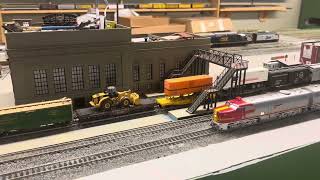 CSX train and Santa Fe super chief on the TAMRRC Ho scale layout