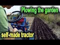 Plowing the garden with a self-made tractor