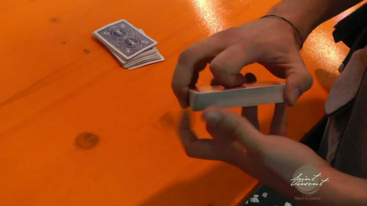 Some sleight of hand magic trick with cards at Masters of Magic 2012