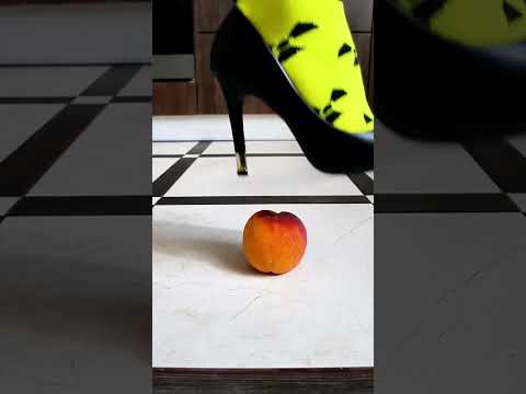 Fancy high heels step on peach