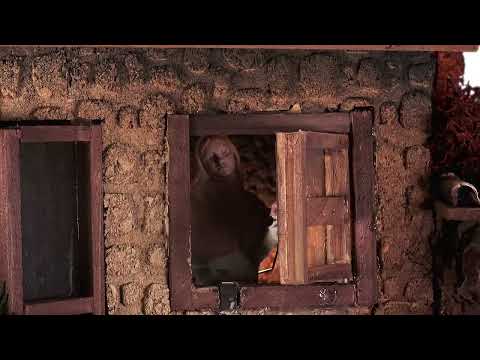 Illuminated village with moving woman cm 50x30x41.5 h video