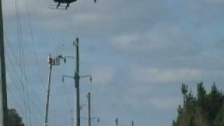 Helicopter Flys-in 115 kV Transmission Line