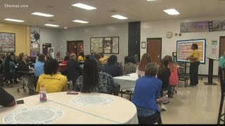 Appling Middle teachers go through 'poverty simulator' screenshot 1