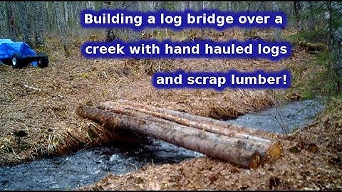 homesteading in Alaska, building a log bridge phase 1. how to build a log bridge. log construction.