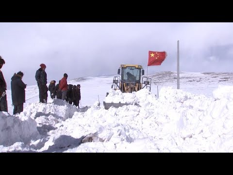 China Initiates National Emergency Response Mechanism for Snowstorm in Qinghai newspaper mockup