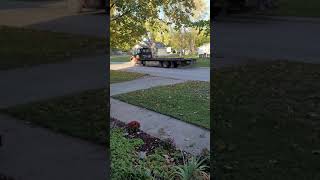 neighbor blocking driveway with his tow truck.