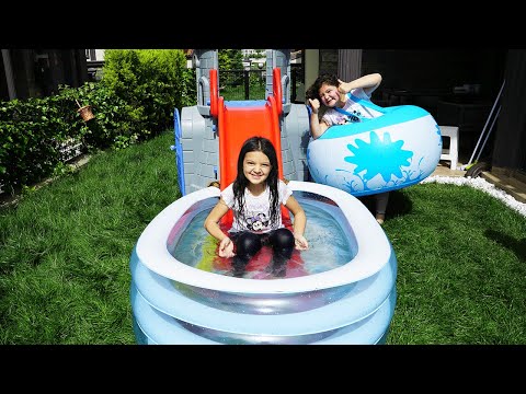 Masal and Öykü with playing fun water slide