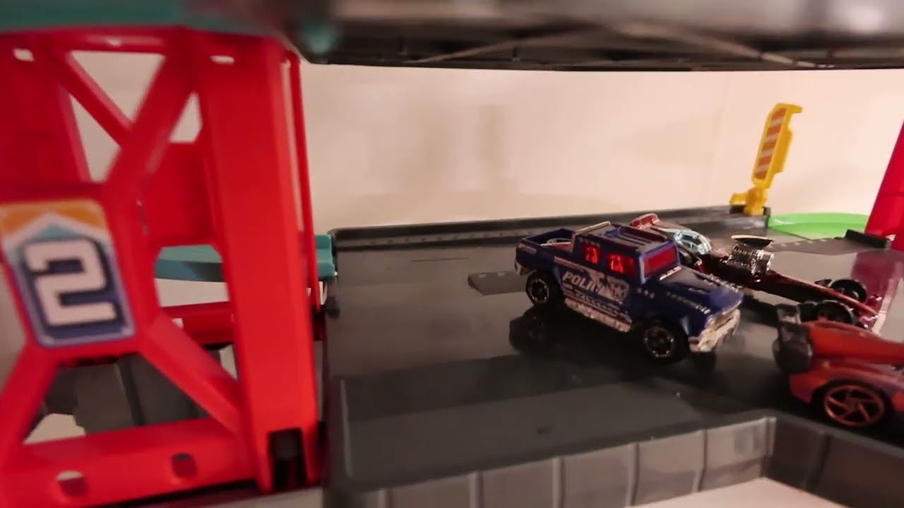 Cars Drive Through Parking Garage into colorful water