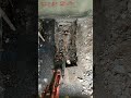 Typically foundation exposure is conducted by hand digging but when the ground is too dense and when you have a good (careful) operator, mechanical excavation can be very useful.