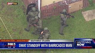 SWAT standoff with barricaded man