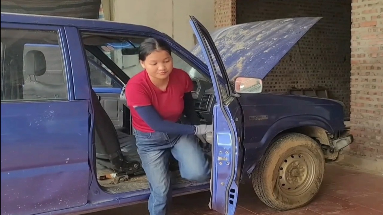 The engine of an abandoned car was brought to the garage for repair