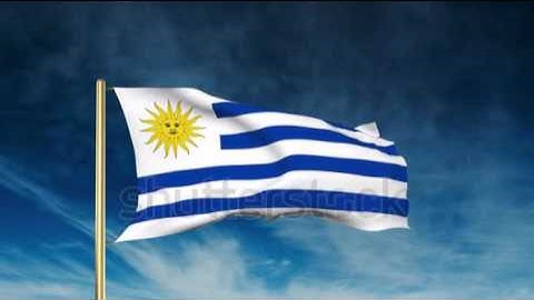 Uruguay flag slider style. Waving in the win with cloud background animation Stock video by
