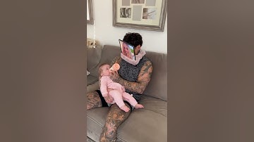 Dad outsmarts baby while feeding