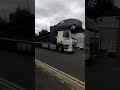 Skilled driver parks car on a transporter truck