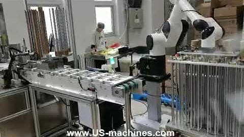 Ice cream lid spoon assembly machine with robot hand sorting stacking system