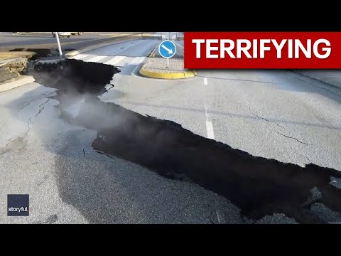 Crack splits street in Icelandic town threatened by volcano - YouTube