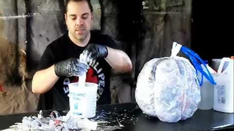 Applying paper mache -- Part 2 of 8 - Paper Mache Pumpkin Head How-to