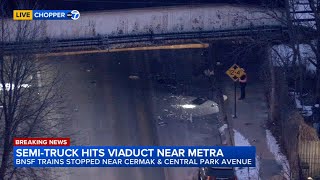 Metra BNSF train service disrupted after truck hits bridge