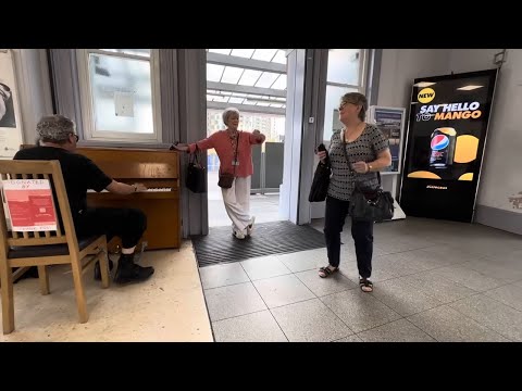 Two Ladies Do A Boogie Woogie Dance At The Piano thumbnail