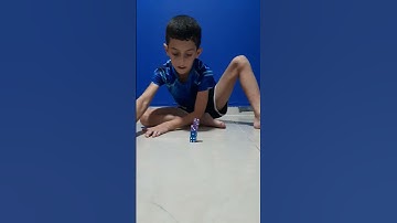 Knocking the bottom dice from a stack