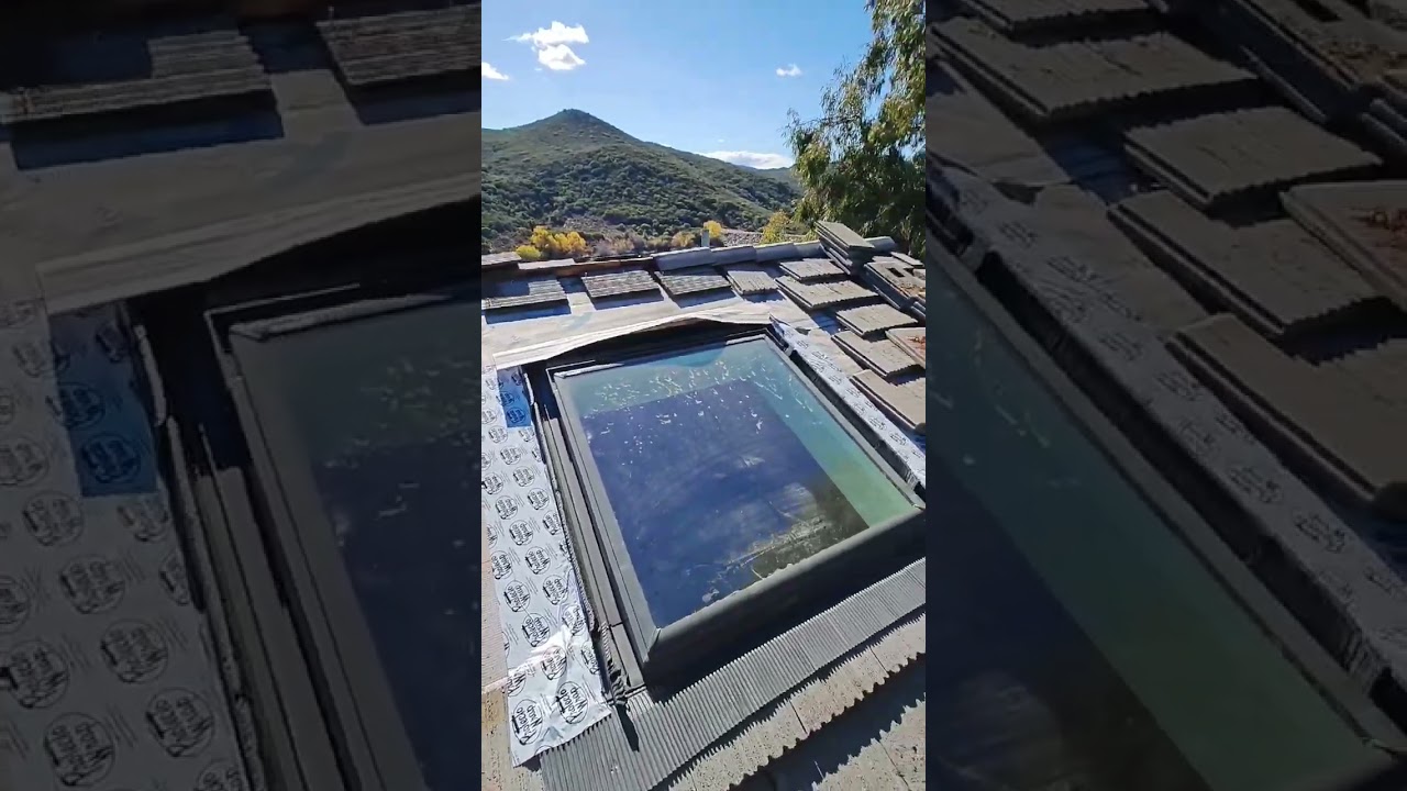 Skylight flashing and roof tiles cut to fit 