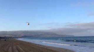 Helicopter flying very low over me in Redondo Beach Califor