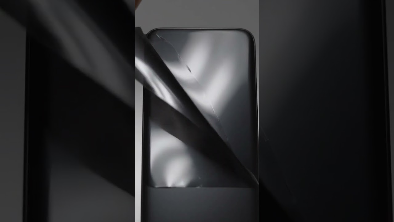 Pristine transparent protective film being slowly peeled