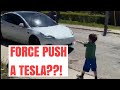 Kid Jedi force pushes a Tesla model 3!
