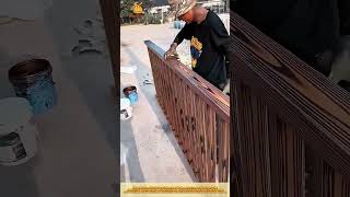 Skilled Worker Creating Wood Grain Effect Using Brush Technique