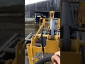Electric loader with scraper