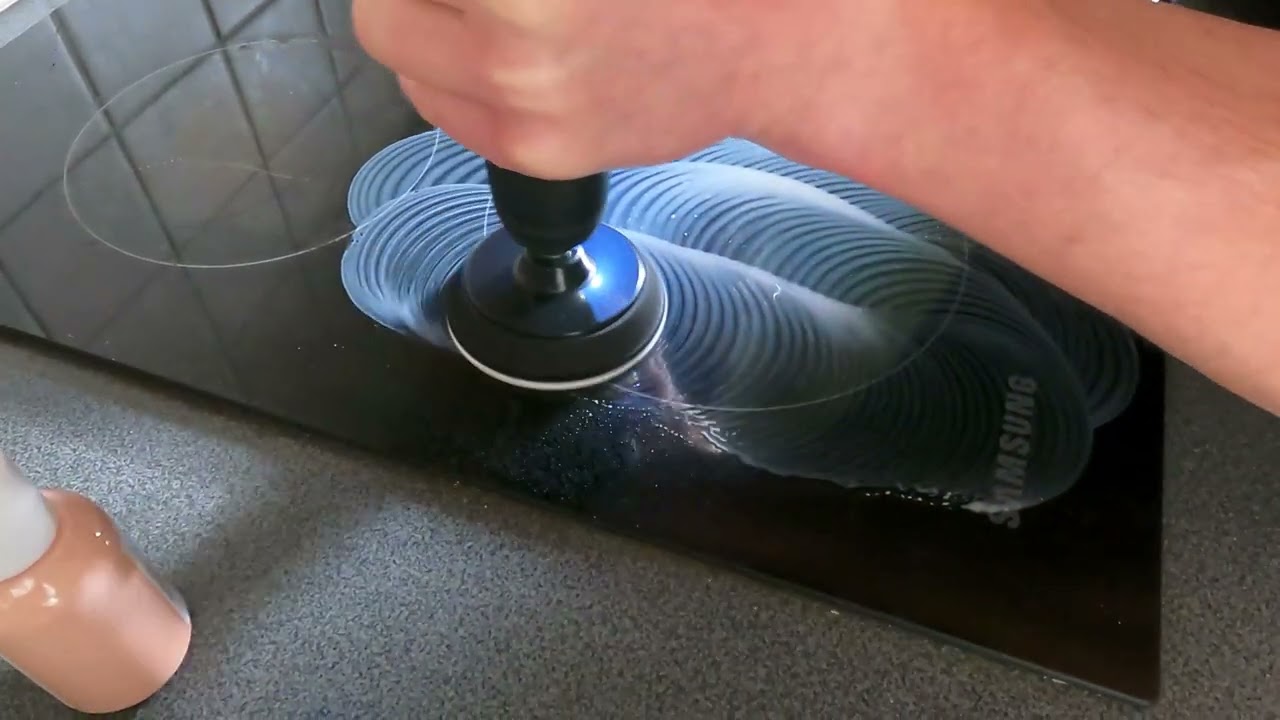 professional cooktop restoration with rotary polisher on glass ceramic surface