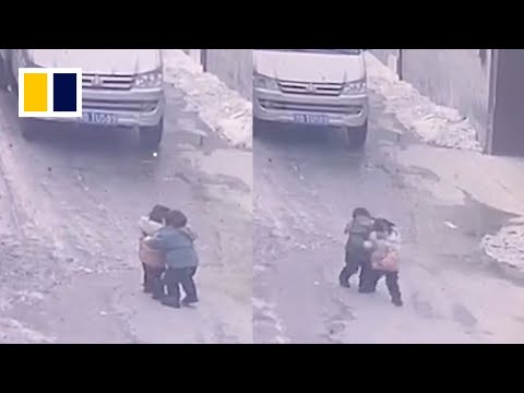 Little boy runs in front of car to protect cousin